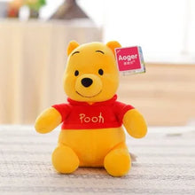 Jucarie de Plus, Winnie the Pooh pufos culoare Galben, cu tricou Rosu, 23cm.